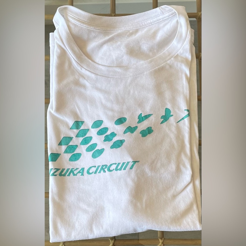 Large blue and white Suzuka Circuit graphic tee.